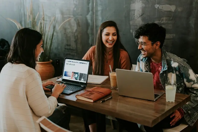 College students studying together at a table